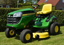 What are the advantages and disadvantages of a riding lawn mower